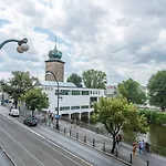 Riverside Apartment With A Balcony
